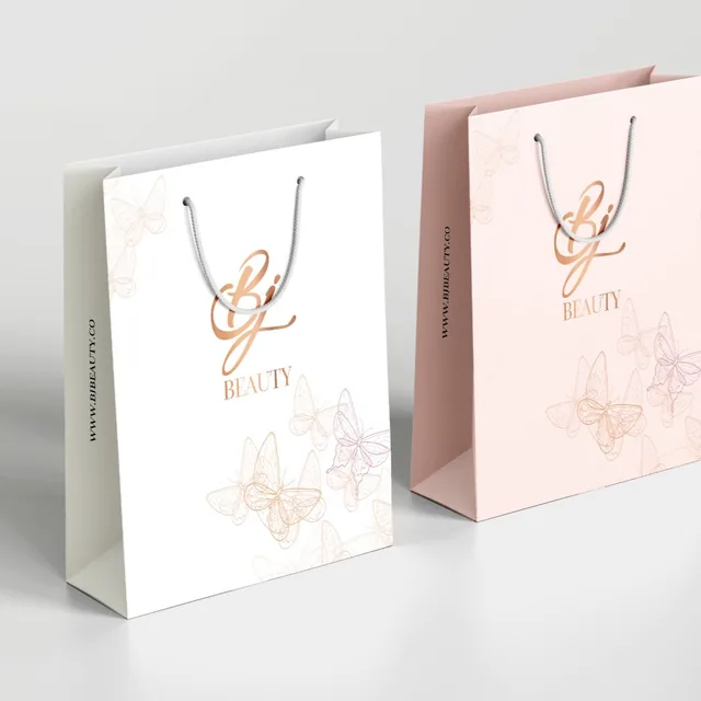 White and pink paper bags with foil logo