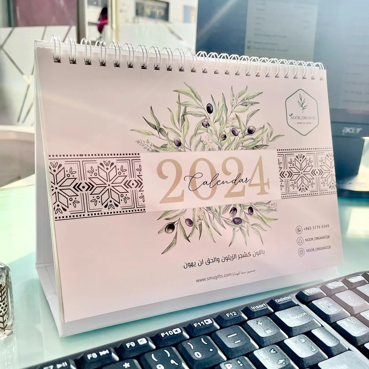 Spiral desk calendar with Arabic and English layout