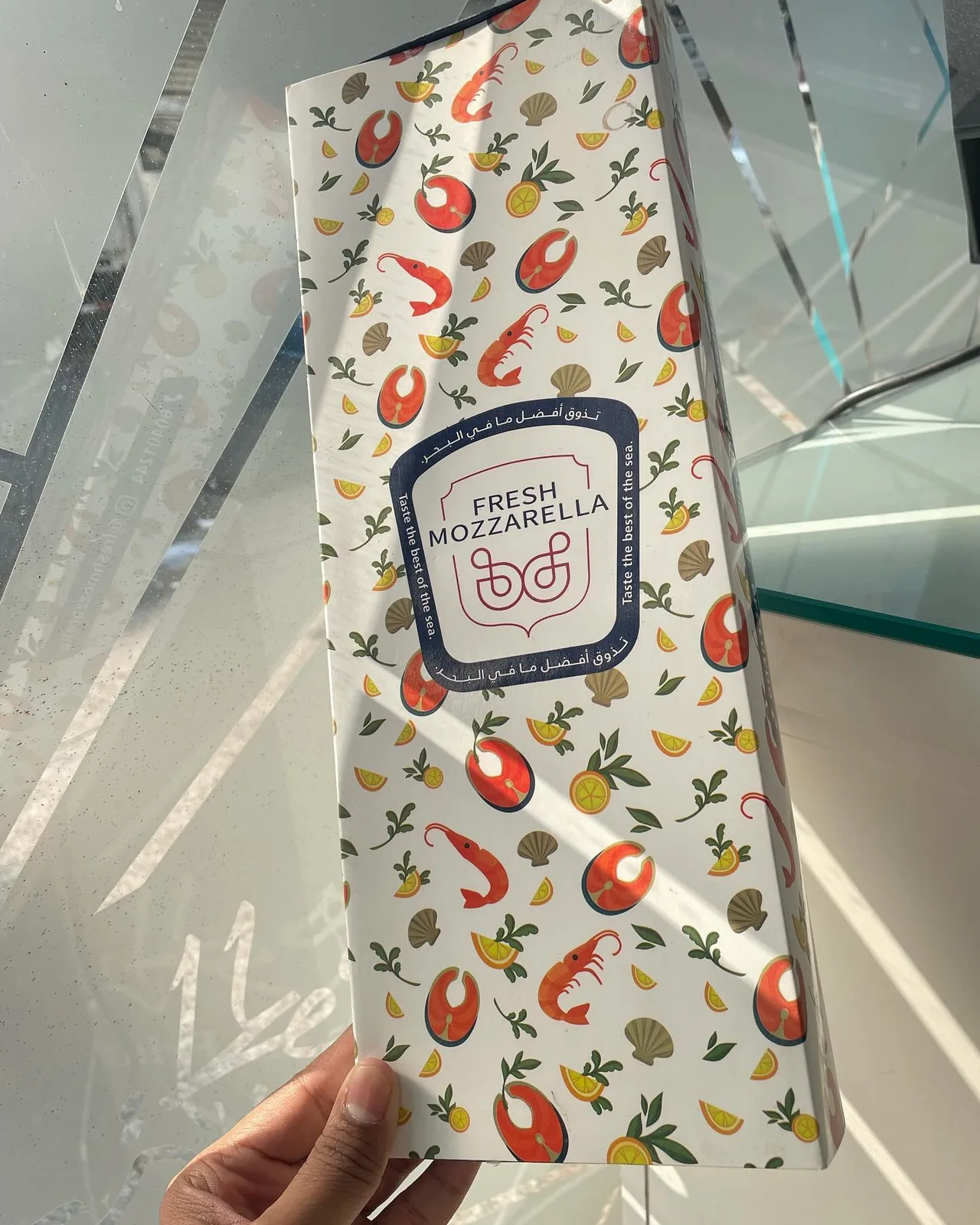 Patterned chocolate sleeve box held in hand