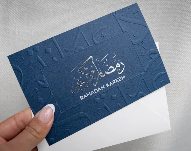 Navy card with embossed and foil-stamped Ramadan greeting